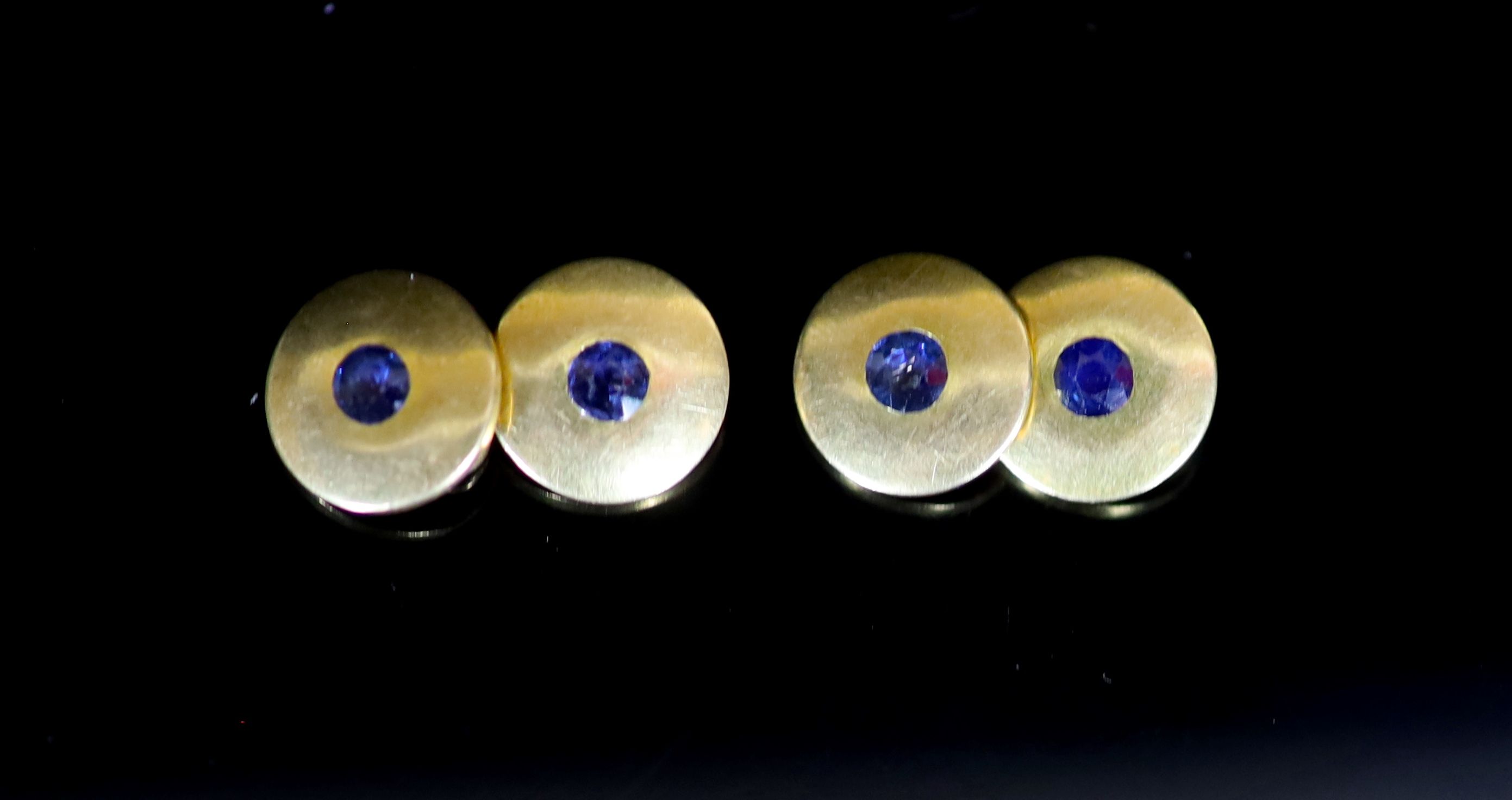 A pair of 18ct gold and sapphire set double disc cufflinks